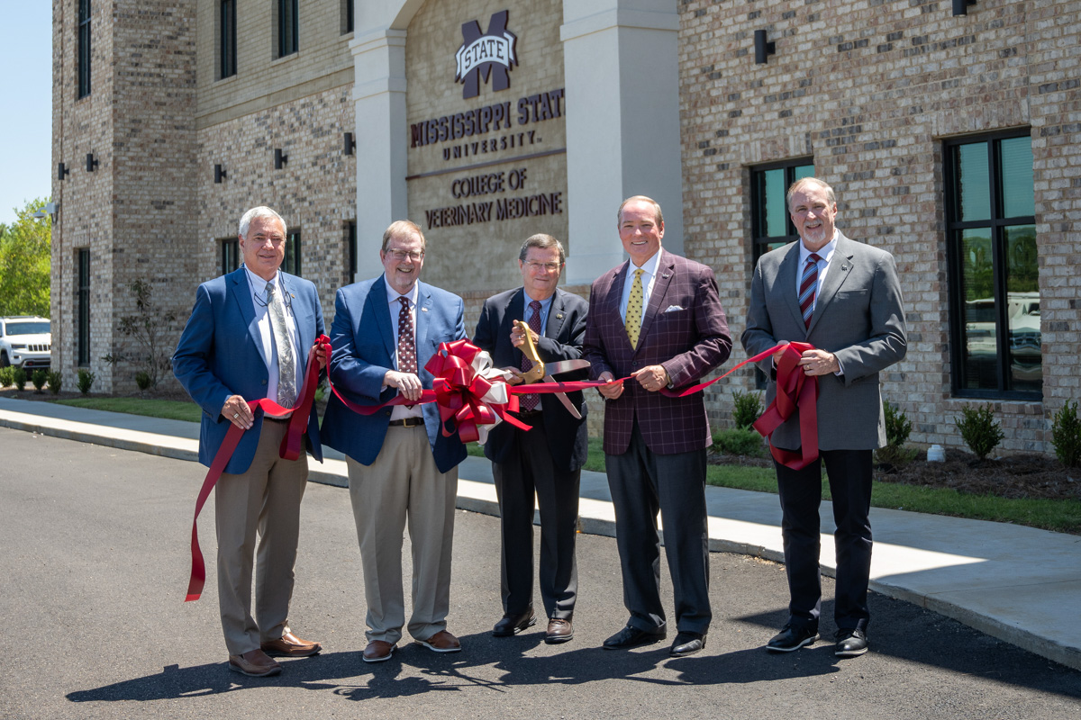 Celebrating a ribbon-cutting ceremony Aug. 17 for the MSU College of Veterinary Medicine’s newly renovated and expanded Animal E