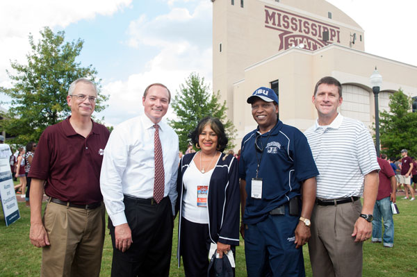 Dr. Keenum stands with Jerry Gilbert (MSU provost), Hank Bounds (MS Commissioner of Higher Education), and officials from Jackson State University at the MSU/JSU football game.