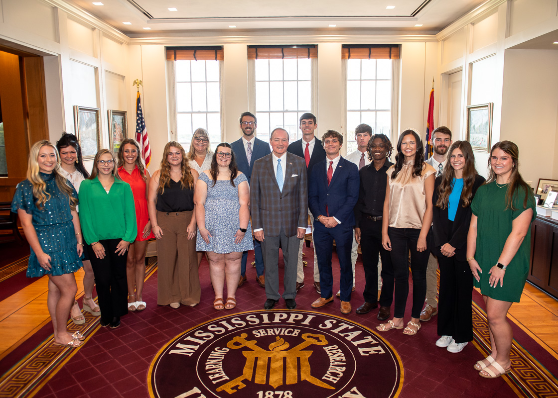 Mississippi State President Mark E. Keenum congratulates this fall’s 16 top transfer students who are recipients of Presidential