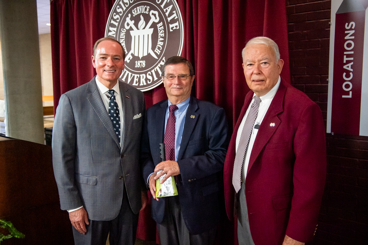 MSU President Mark E. Keenum (left) and Dean Council Chairman, Dr Mikell Davis (right), join the College of Veterinary Medicine 
