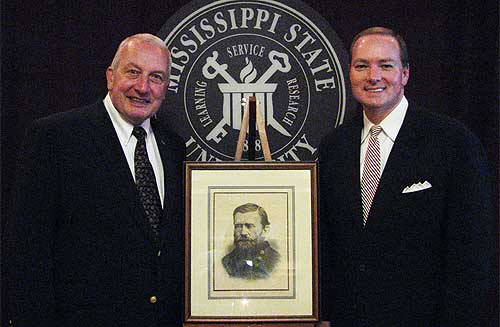 U.S. Grant Association President and Rhode Island Chief Justice Frank J. Williams (left) poses with Mississippi State President Mark E. Keenum and a portrait of Grant during the association's annual--and first--meeting at the university.