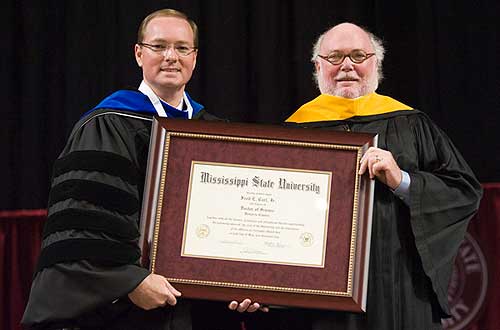 During Spring Commencement, President Keenum awarded an honorary doctor of science degree to Fred E. Carl Jr.
