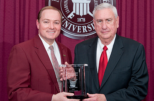 President Keenum congratulated Roy Ruby, former student affairs vice president and interim president, after the 2010 Alumni Association Awards Banquet for being named the National Alumnus of the Year.