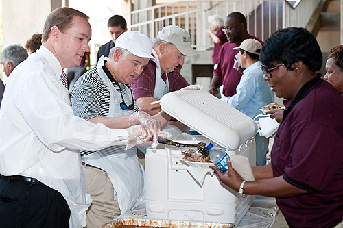 President Keenum joined other administrators to serve barbecue pork and chicken for lunch on Staff Appreciation Day at the Junction.