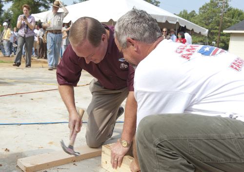 President Keenum lends a hammer and a hand to help construct the 2010 Maroon Edition Habitat House.