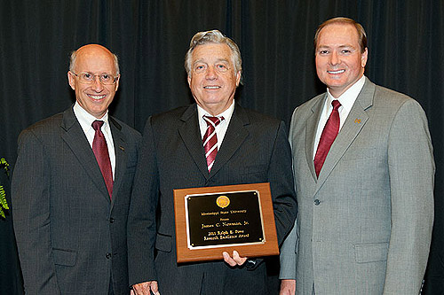 Dr. Keenum and Dr. David Shaw recognize aerospace engineering professor Dr. James Newman (center) with the Ralph E. Powe Research Excellence Award.