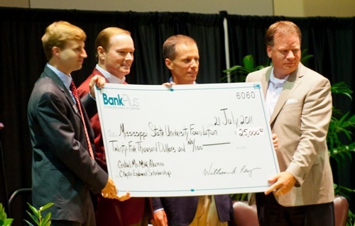 Dr. Mark Keenum receives cheque for Central Mississippi Alumni Chapter endowed scholarship.