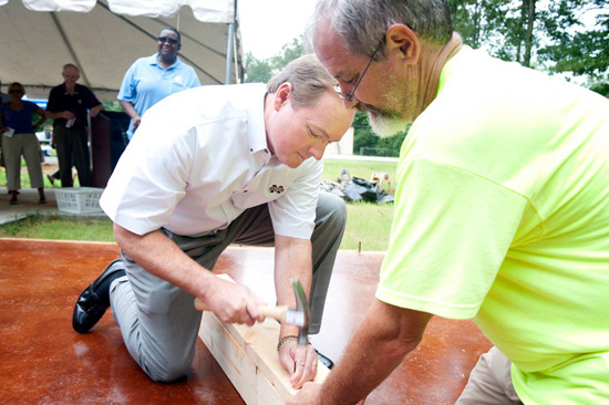 President Keenum helps with the Maroon Edition Habitat build.