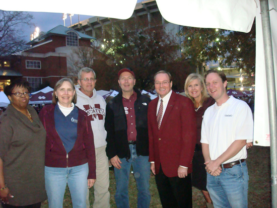 President Keenum visits with staff from University Medical Center at their tailgate in The Junction.
