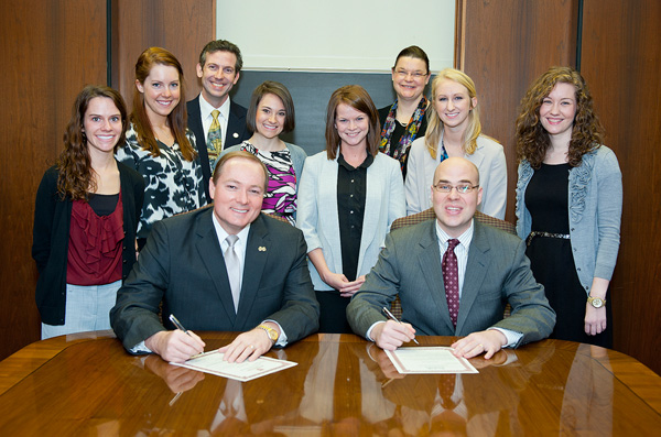 Dr. Keenum and Mayor Wiseman sign the Nutrition Day proclamation.