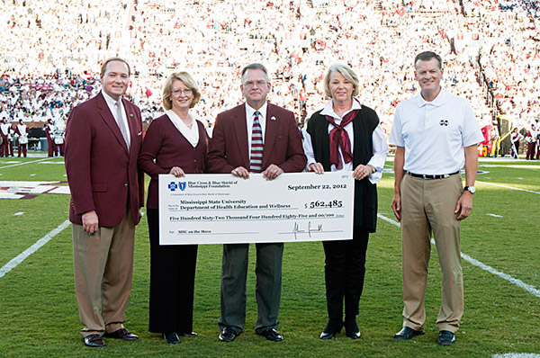 Sheila Grogan, second from left, executive director of the Blue Cross & Blue Shield of Mississippi Foundation, presented a grant check for $562,485 to MSU President Mark Keenum, Vice President for Student Affairs Bill Kibler, Health Education and Wellnes