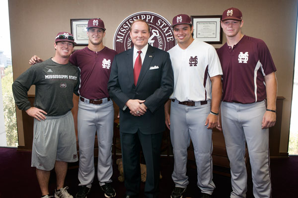 Members of the MSU baseball team presented Dr. Keenum, center, with a championship ring commemorating the Diamond Dawgs' 2012 Southeastern Conference Tournament title.