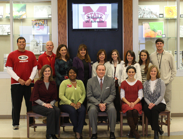 MSU President Mark E. Keenum with Bulldog alumni among the Germantown High School faculty and staff during a recent campus visit with students at the new Madison County, Miss.
