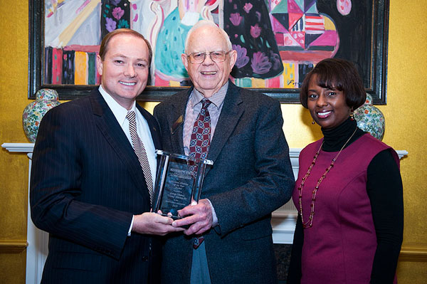Dr. Keenum stands with Alumnus of the Year Tommy Everett and Camille Young.