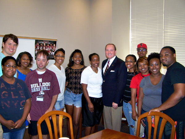 MSU President Mark E. Keenum, center, recently spoke to students in Mississippi State's TRIO Program during their annual luncheon held in Montgomery Hall.