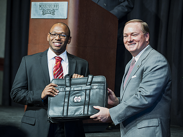 Donald M. "Field" Brown, left, Mississippi State's 2014 Rhodes Scholar, received a briefcase from MSU President Mark E. Keenum at the university's annual Martin Luther King, Jr.