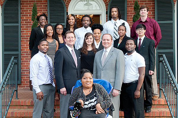 Entergy Mississippi Vice President of Public Affairs John Arledge, front row second from left, spoke to MSU Promise Program students in April at the home of President and Mrs. Mark E. Keenum.