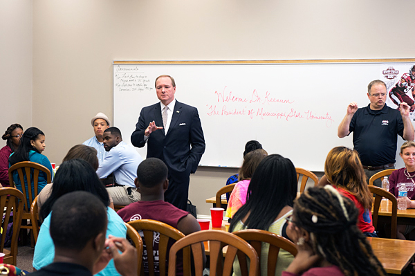 Mississippi State President Mark E. Keenum, center, tells students participating in the university's TRIO program about the skills they'll need to be successful academically and professionally.