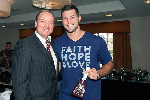 Tim Tebow, right, co-host of the SEC Network’s college football morning show "SEC Nation," received an MSU cowbell this morning [Oct.