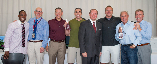 ESPN’s College GameDay crew met with and received cowbells from MSU President Mark E. Keenum, center front, and Athletic Director Scott Stricklin, third from left.