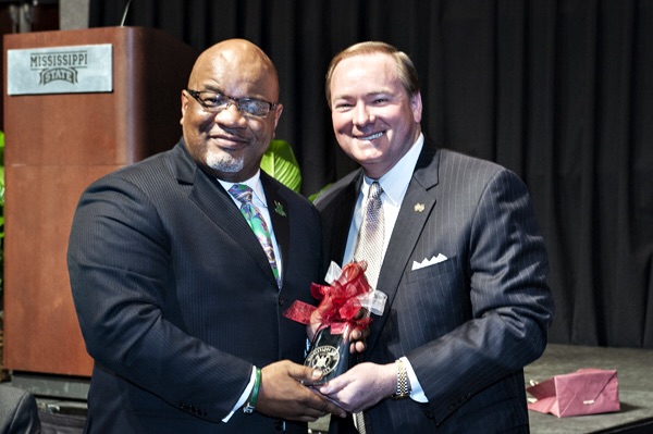 William B. Bynum Jr., left, president of Mississippi Valley State University, received a special cowbell from MSU President Mark E. Keenum.