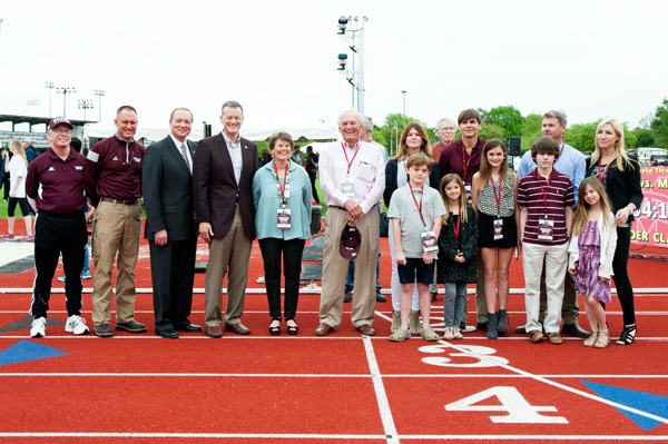 MSU officials including, from left, former coach Al Schmidt, track coach Steve Dudley, MSU President Mark E. Keenum, MSU Athletic Director Scott Stricklin, Nan and Mike Sanders, as well as additional members of their family, celebrated the official namin