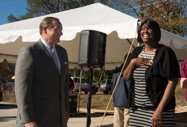 MSU President Mark E. Keenum presented a Bible to the Shalisha Owens family at the dedication ceremony for their new home Thursday [Dec.