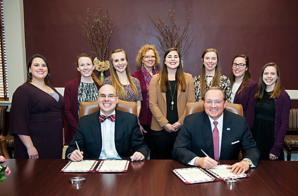 Mississippi State University President Mark E. Keenum, seated right, and Starkville Mayor Parker Wiseman met with MSU’s Student Dietetic Association officers and advisor to proclaim March as National Nutrition Month for MSU and the city of Starkville.