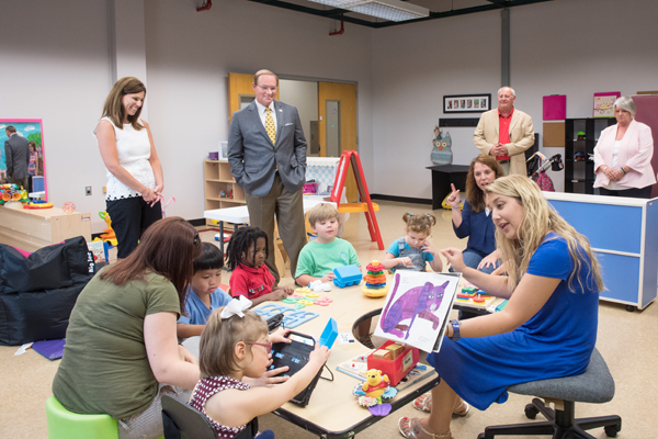 Mississippi State University President Mark E. Keenum visits with students from the Project IMPACT program during a tour of MSU's T.K. Martin Center for Technology and Disability on Tuesday [July 19].