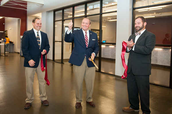University and USPS officials pose following a ribbon cutting for the newly renovated Roberts Building at MSU. Pictured, from left to right, are: MSU Postmaster Ken Oglesbee, MSU President Mark E. Keenum, MSU Director of Parking, Transit and Sustainabili