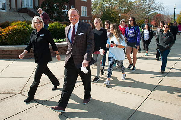 MSU President Mark E. Keenum joins a "Celebrity Walk" around the Drill Field with MSU students and Director of Health Promotion and Wellness Joyce Yates.