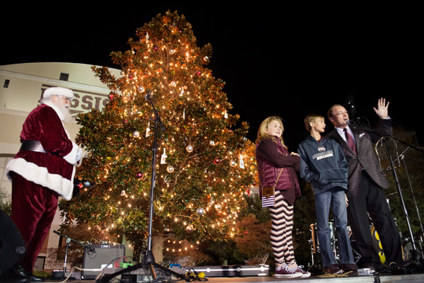 MSU President Mark E. Keenum, along with his daughter Torie and son Rett, worked with Santa to light the Christmas tree during Holiday in the Junction on Dec.