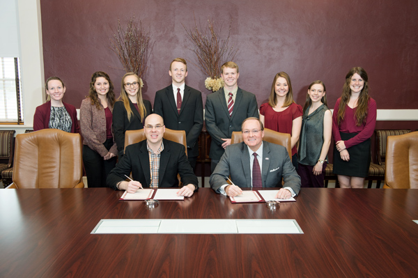 Starkville Mayor Parker Wiseman and Mississippi State President Mark E. Keenum (seated left and right) marked National Nutrition Month with the signing of a proclamation announcing the city and campus observance of the annual March event.