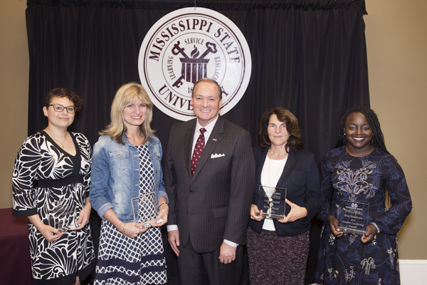 Pictured with MSU President Mark E. Keenum, center, Mississippi State University President’s Commission on the Status of Women’s 2018 Outstanding Women award recipients include, from left to right, Sarah E. “Izzy” Pellegrine, Leslie Fye, (Keenum)