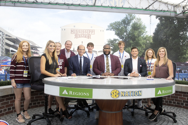 MSU President Mark E. Keenum takes part in a group photo with the hosts of SEC Nation
