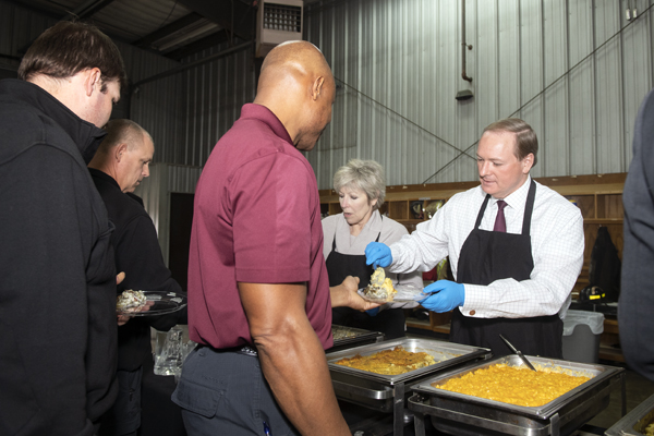 Starkville Mayor Lynn Spruill and MSU President Mark E. Keenum serve a Thanksgiving lunch to area first responders on Monday [No