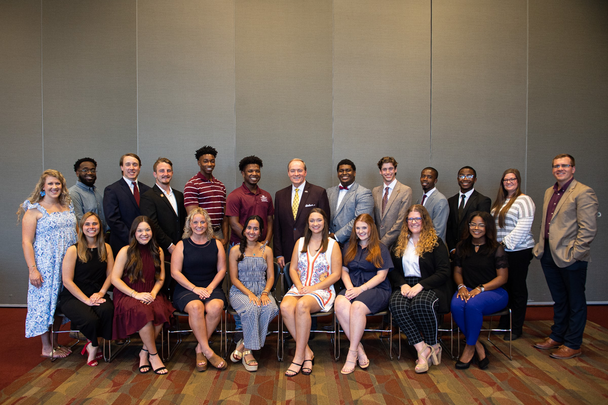 Orientation Leaders are pictured with MSU President Mark E. Keenum (center, back row) and Director of Orientation and Events Jak