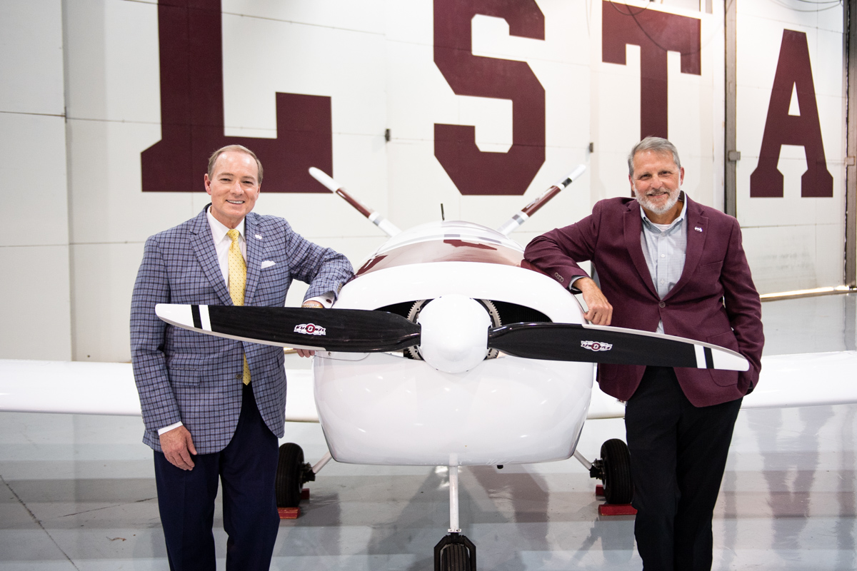 MSU President Mark E. Keenum and Raspet Flight Research Lab Director Tom Brooks pose next to the lab’s new Teros uncrewed aircra