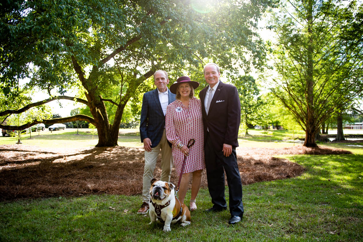 MSU President Mark E. Keenum smiles with ‘Dak’ (Bully XXII) and his owners, Bruce and Julie Martin of Meridian, at an official w