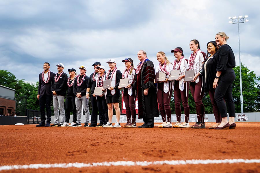 Annually, MSU President Mark E. Keenum, center, participates in a special graduation ceremony for the university’s softball players in the spring at Nusz Park. It is an exceptional moment for these senior scholar-athletes who have worked hard all year at their sport and their studies. 