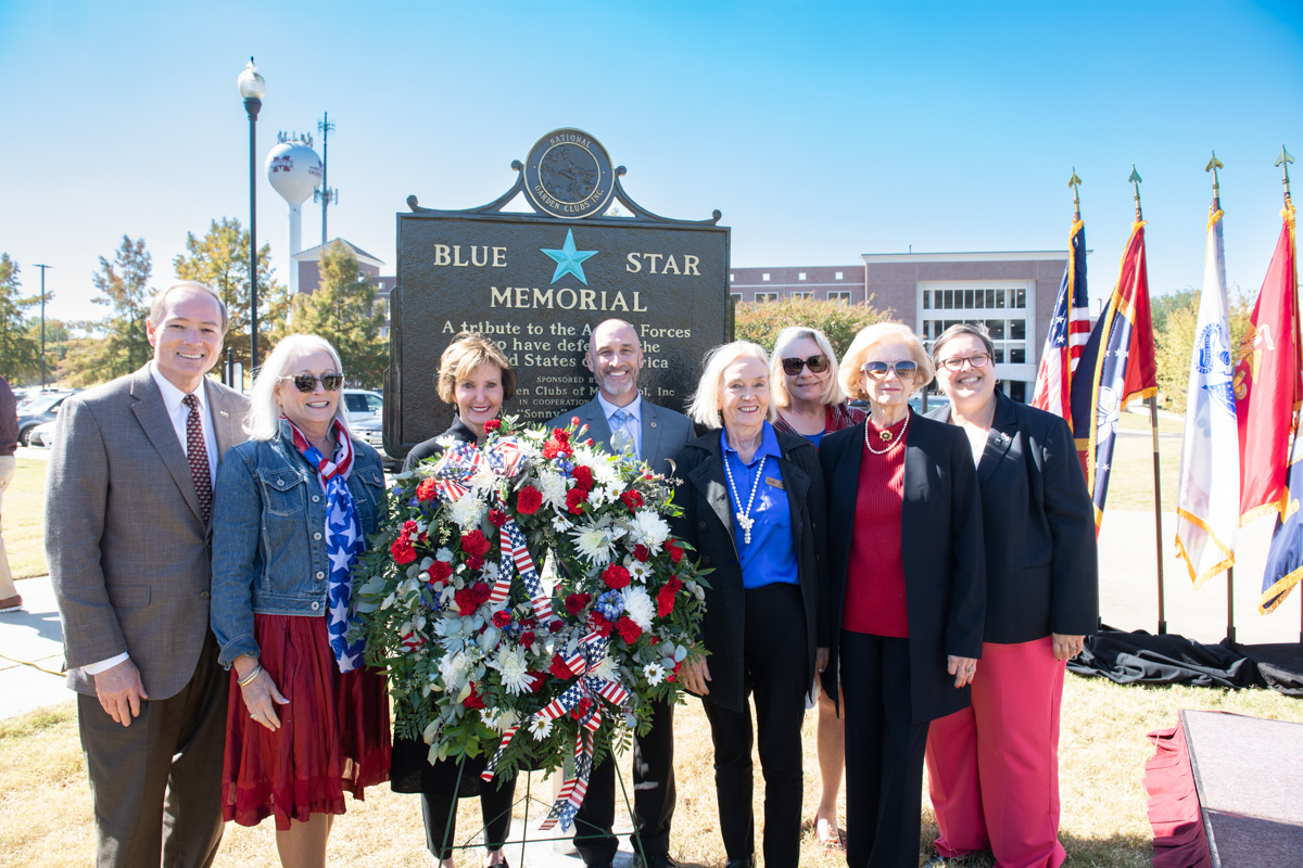 With the freshly unveiled Blue Star Memorial behind them, Keenum stands at the far left of MS Garden Club group.