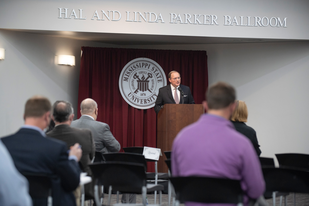 President Keenum speaks to faculty and administrators from a podium at the Hunter Henry Center ballroom.