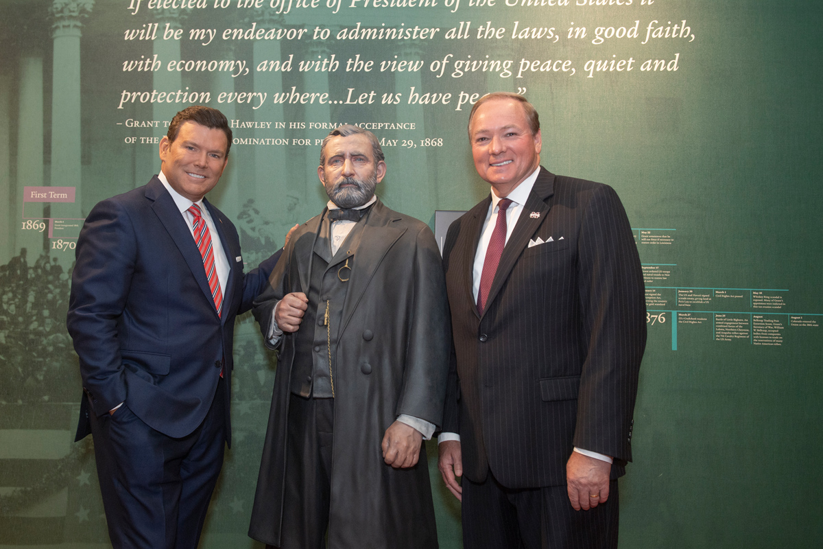 With the Ulysses S. Grant life-size statue between them, national journalist Bret Baier poses for a photo with President Keenum.