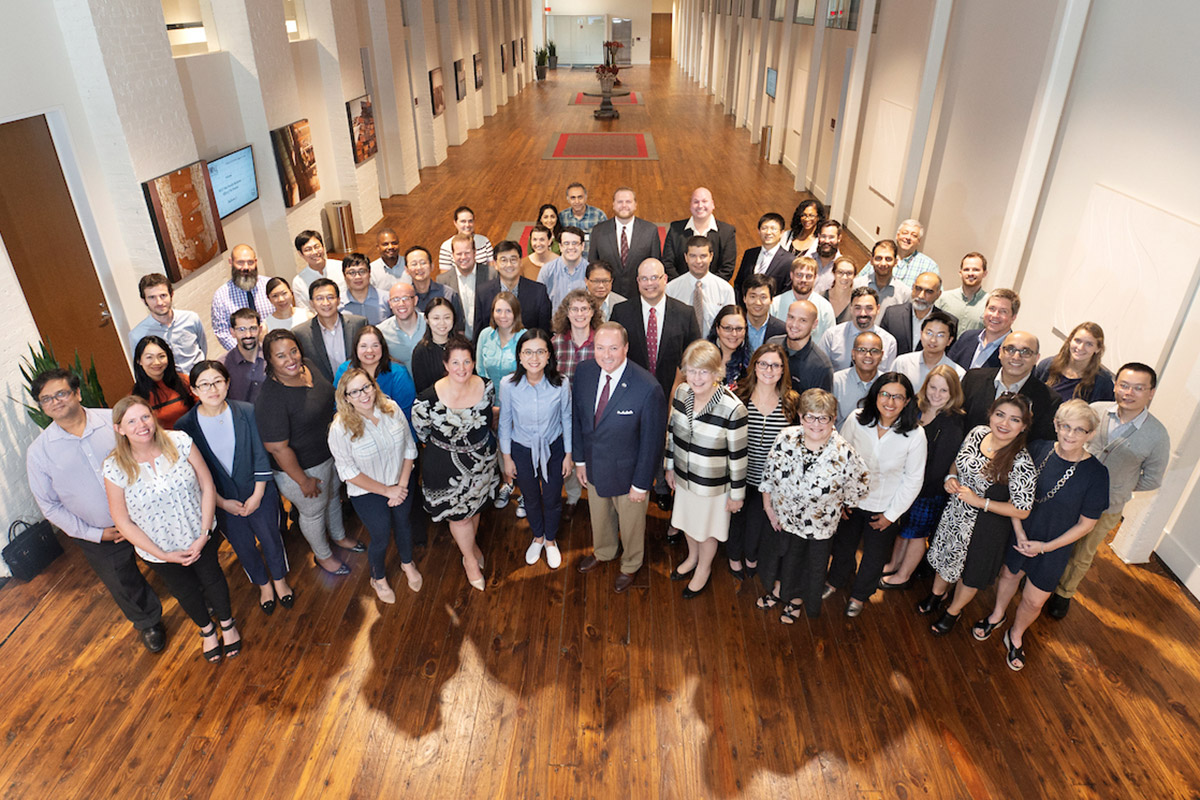  Mark E. Keenum, front center, welcomes more than 70 new academic personnel attending a reception in their honor in August