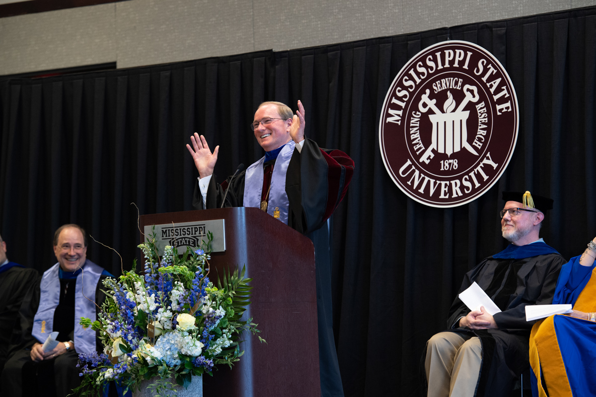 President Keenum smiles and gesticulates while giving keynote address at Phi Beta Kappa induction ceremony