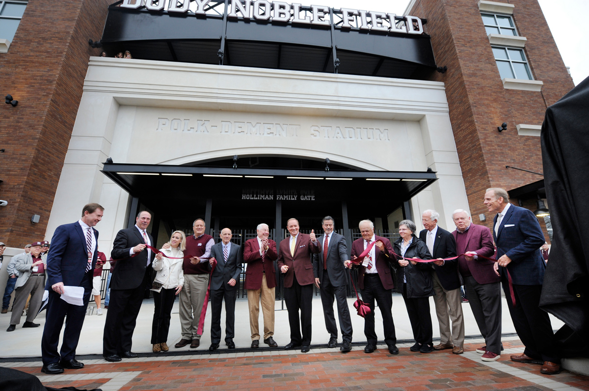 President Keenum and VIPs are all smiles after the cutting of the ribbon in front of the new Dudy Noble Field.