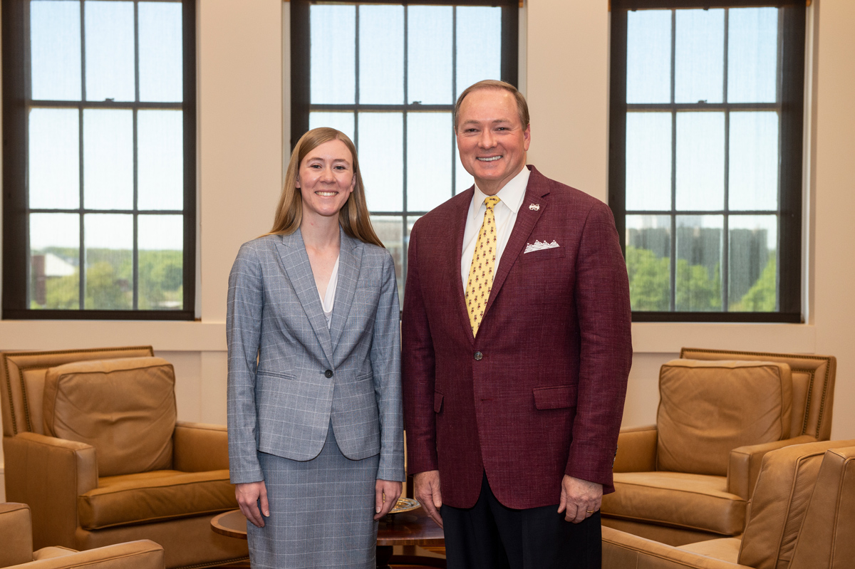 Alicia D. Brown, a senior chemical engineering major from Petal, is congratulated by MSU President Mark E. Keenum.