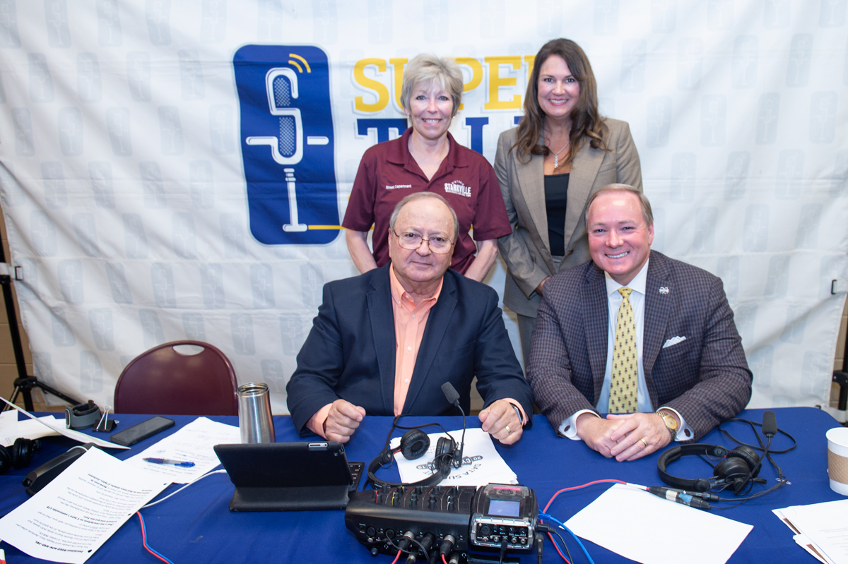 Photographed in a pause in broadcasting SuperTalk Mississippi: Paul Gallo, Lynn Spruill, Bricklee Miller, President Keenum.