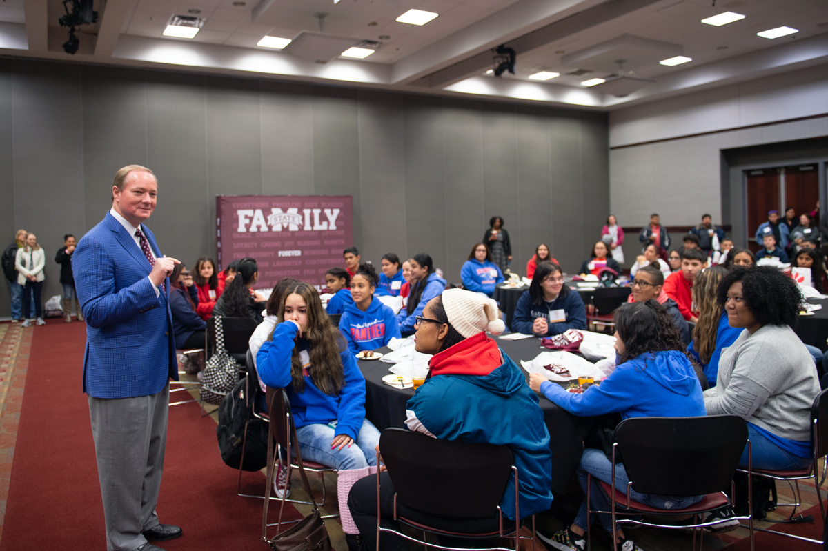 As part of LatinX Preview Day, President Keenum speaks to tables full of Latino high schoolers in the Colvard Union Ballroom.