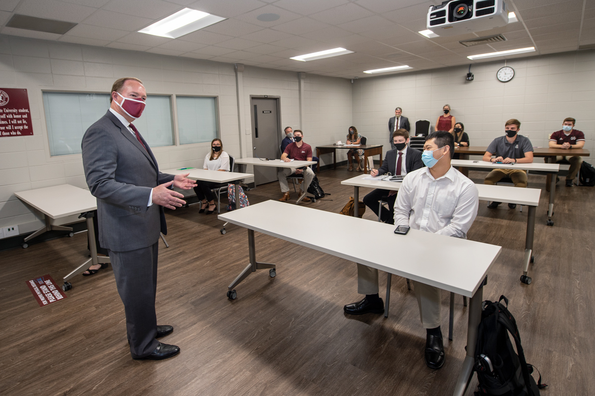 President Keenum speaks to a classroom of socially-distanced  Mississippi Community College Scholars, all wearing masks.